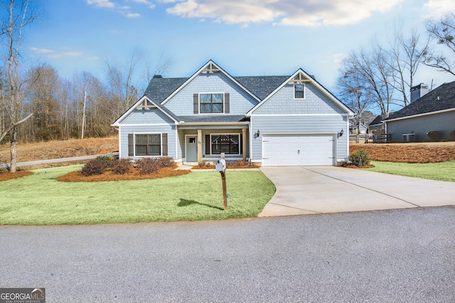 craftsman-style home with a garage and a front lawn