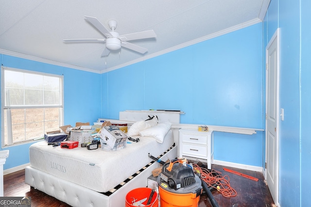 bedroom featuring ornamental molding, dark wood-type flooring, and ceiling fan