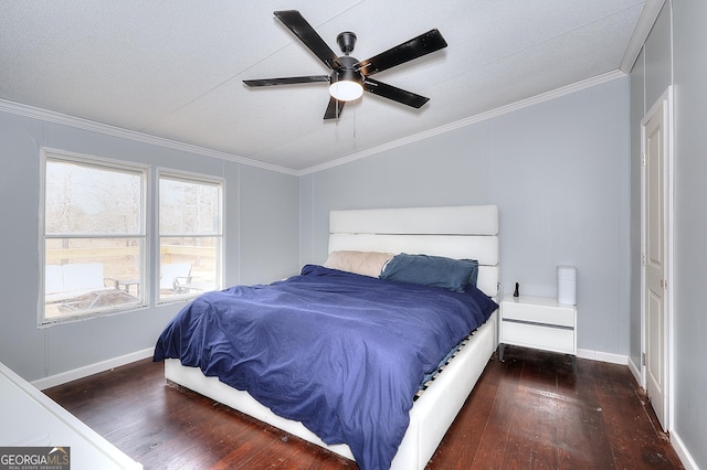 bedroom with vaulted ceiling, ornamental molding, dark wood-type flooring, and ceiling fan