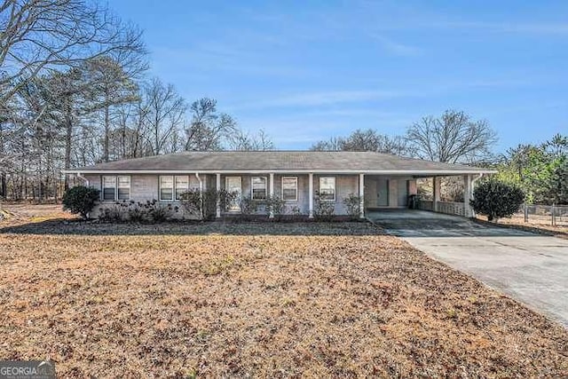 single story home featuring a carport and a front yard