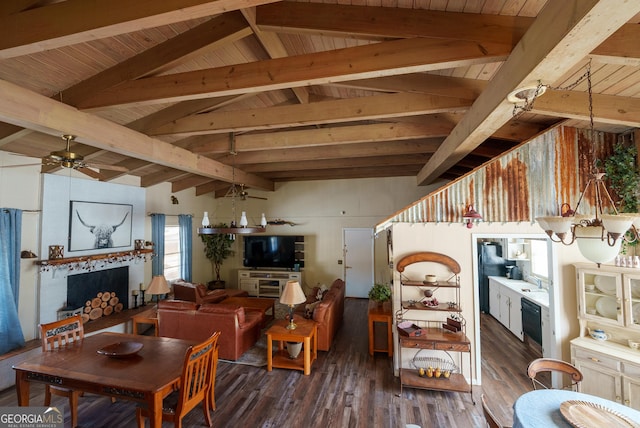 living room featuring dark hardwood / wood-style floors, sink, vaulted ceiling with beams, ceiling fan, and wood ceiling