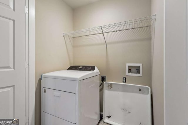 clothes washing area with washer / clothes dryer