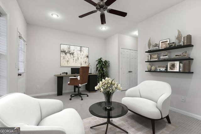 carpeted office featuring ceiling fan