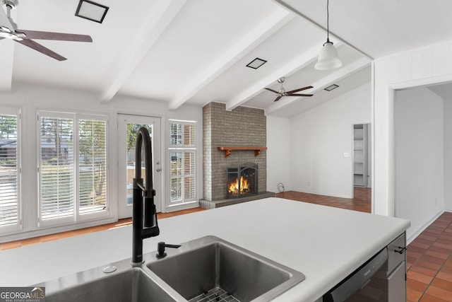 kitchen with a fireplace, lofted ceiling with beams, dishwasher, hanging light fixtures, and ceiling fan