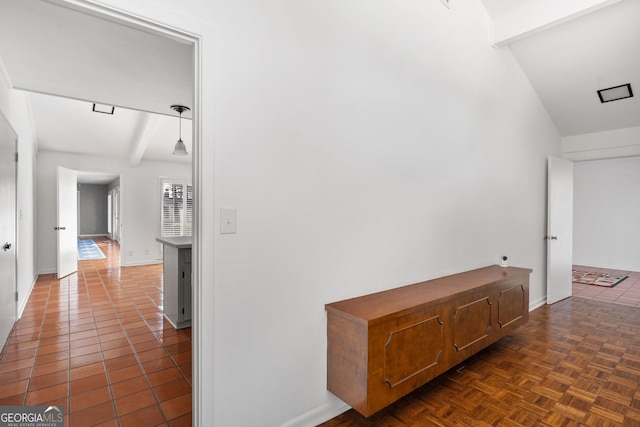 corridor featuring beamed ceiling and dark parquet flooring