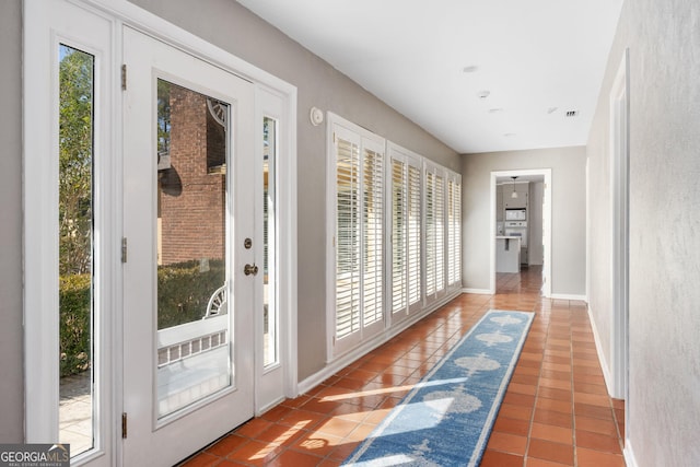 entryway featuring tile patterned flooring