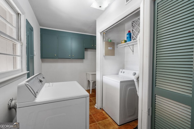 clothes washing area featuring separate washer and dryer and light tile patterned floors