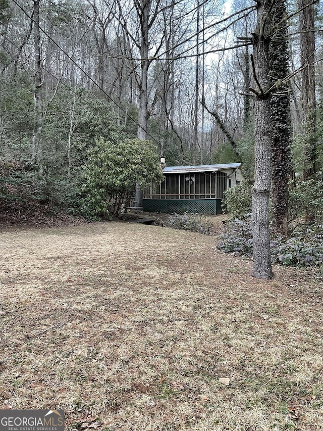 view of yard featuring a sunroom