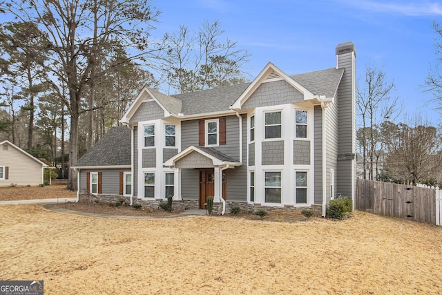 craftsman-style home with a front yard