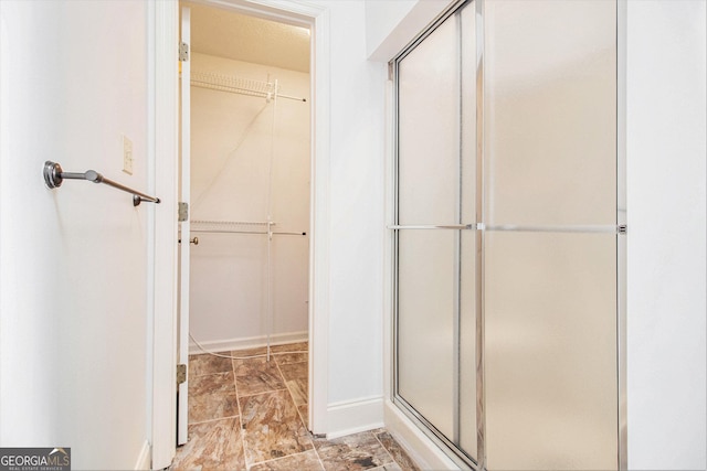 bathroom featuring an enclosed shower