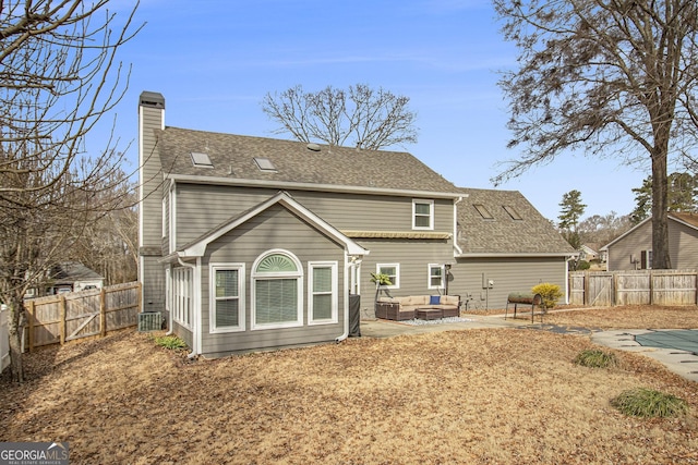 back of house with a patio area and outdoor lounge area