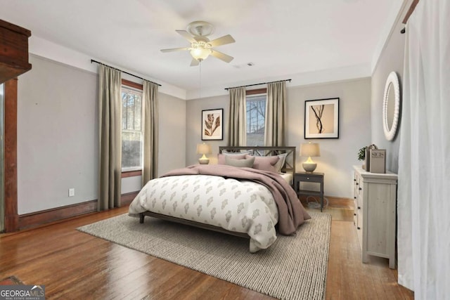 bedroom featuring light hardwood / wood-style flooring and ceiling fan