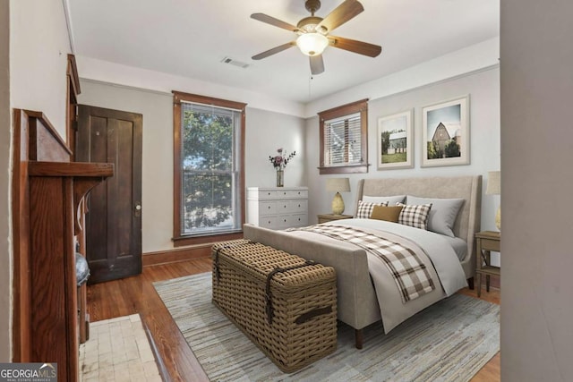 bedroom featuring wood-type flooring and ceiling fan