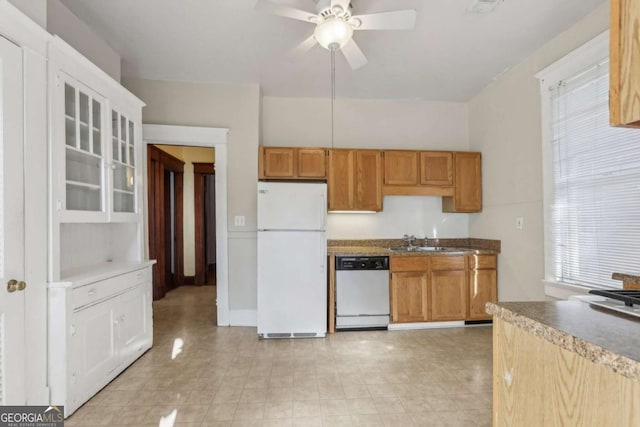 kitchen with sink, ceiling fan, dishwasher, and white refrigerator