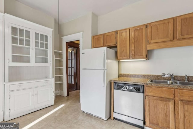 kitchen featuring sink and white appliances