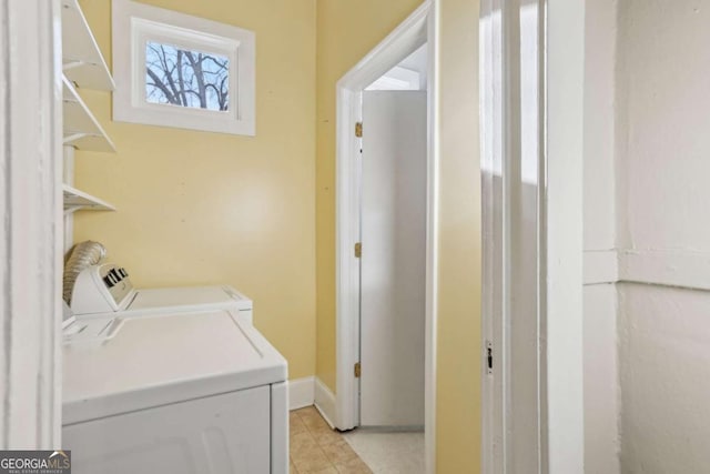 washroom with light tile patterned flooring and independent washer and dryer