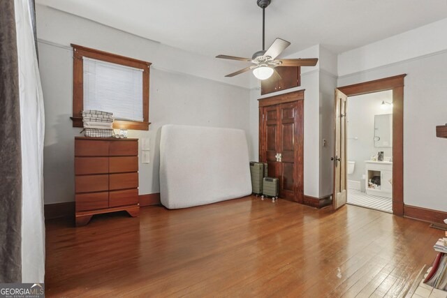 bedroom featuring wood-type flooring and ceiling fan