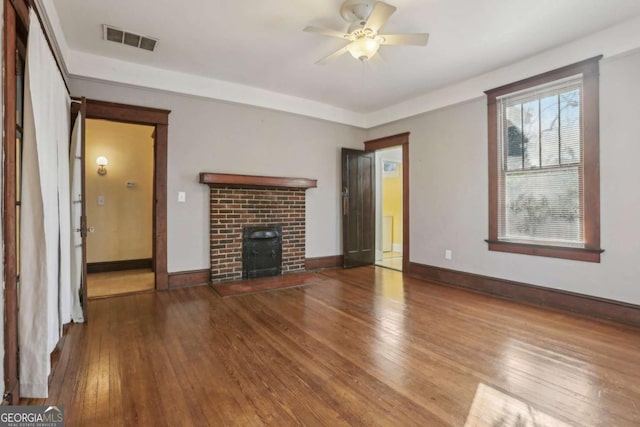 unfurnished living room featuring wood-type flooring and ceiling fan