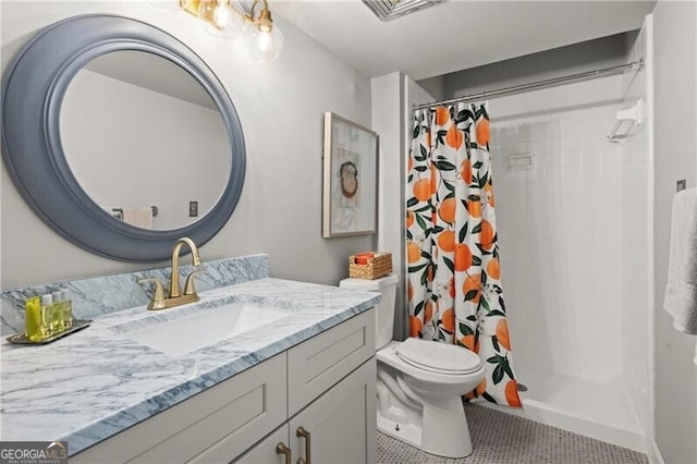 bathroom with a shower with curtain, tile patterned floors, vanity, and toilet