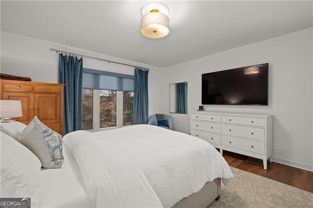 bedroom featuring dark hardwood / wood-style flooring