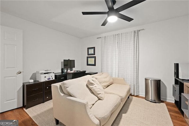 living room with ceiling fan and wood-type flooring