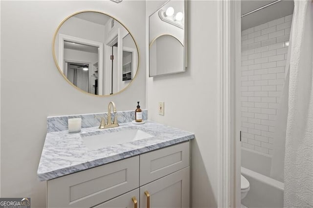 full bathroom with vanity, toilet, and shower / bath combo with shower curtain