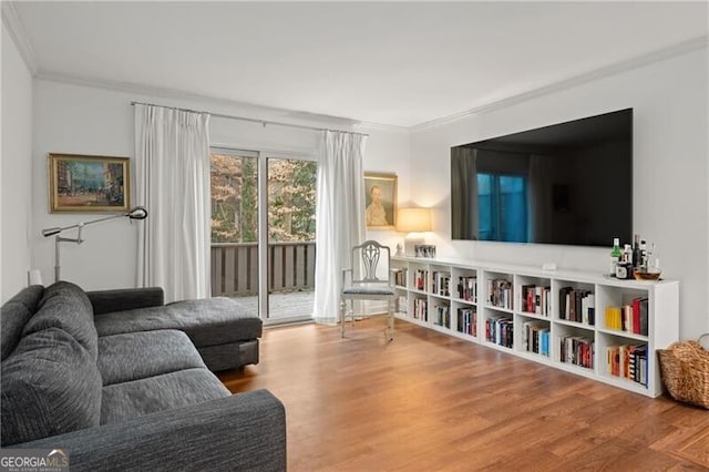 living room featuring ornamental molding and hardwood / wood-style floors