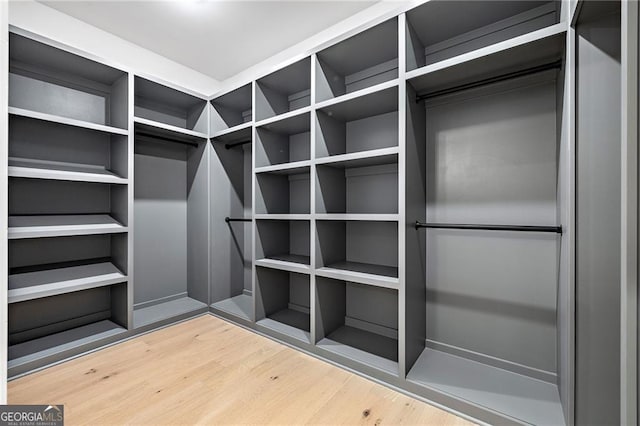 spacious closet featuring hardwood / wood-style flooring