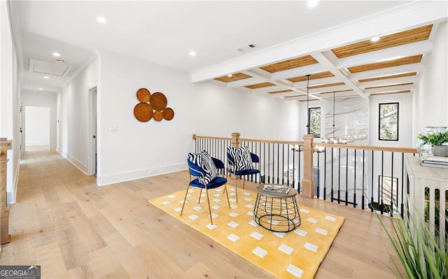 sitting room featuring beamed ceiling, coffered ceiling, and light wood-type flooring