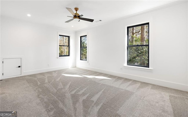 carpeted empty room with ceiling fan