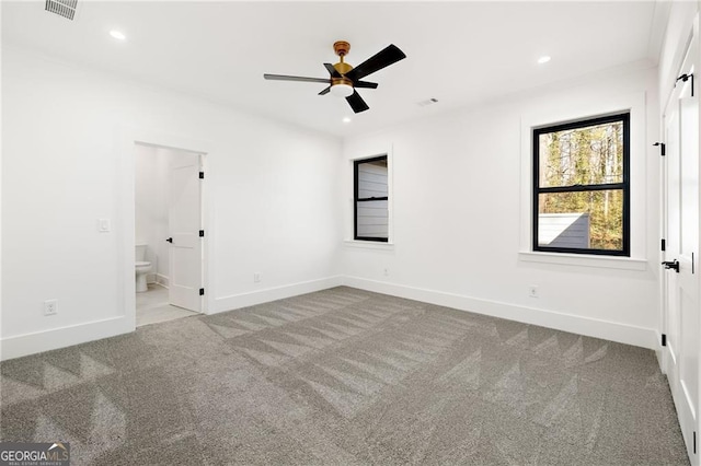 empty room with light colored carpet and ceiling fan