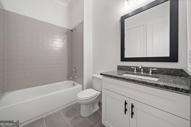 full bathroom featuring vanity, tile patterned floors, toilet, and tiled shower / bath