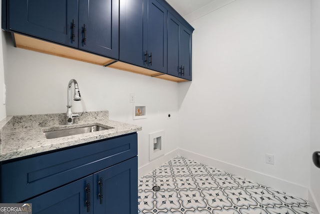 clothes washing area featuring cabinets, washer hookup, hookup for an electric dryer, and sink