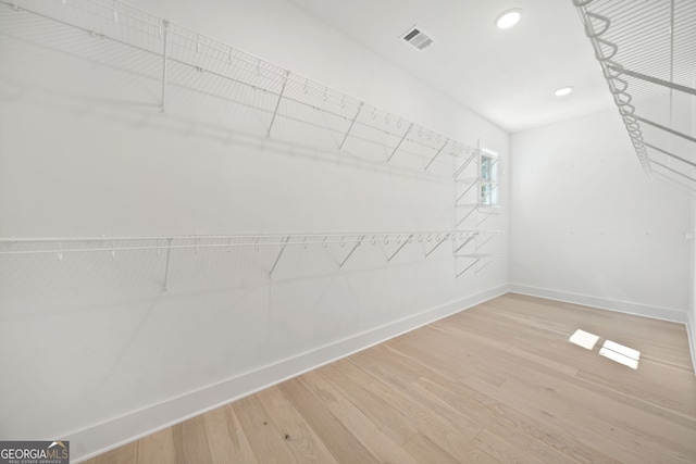 walk in closet featuring hardwood / wood-style floors