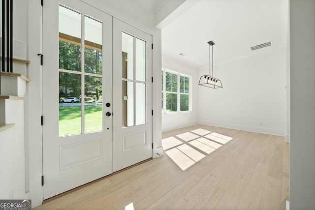 doorway to outside featuring light hardwood / wood-style flooring