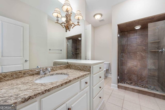 bathroom with walk in shower, tile patterned floors, a chandelier, and vanity