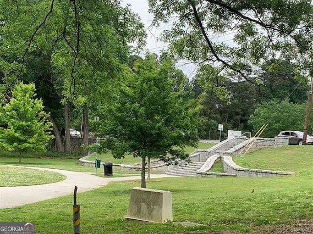 view of home's community featuring a lawn