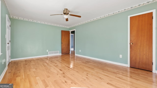 unfurnished room with ceiling fan and light wood-type flooring