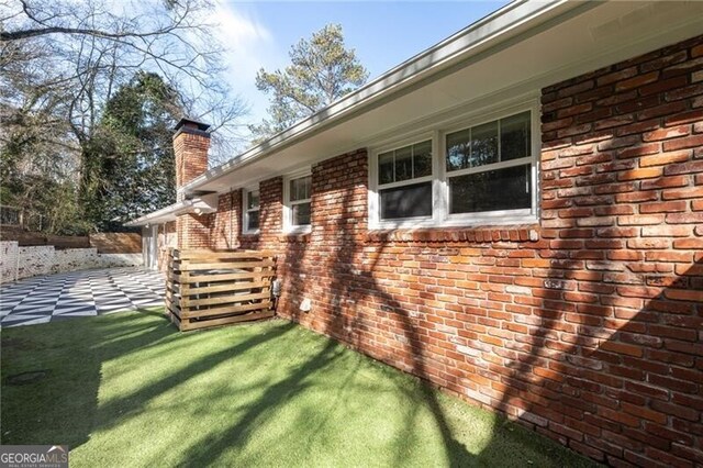 view of property exterior featuring a lawn