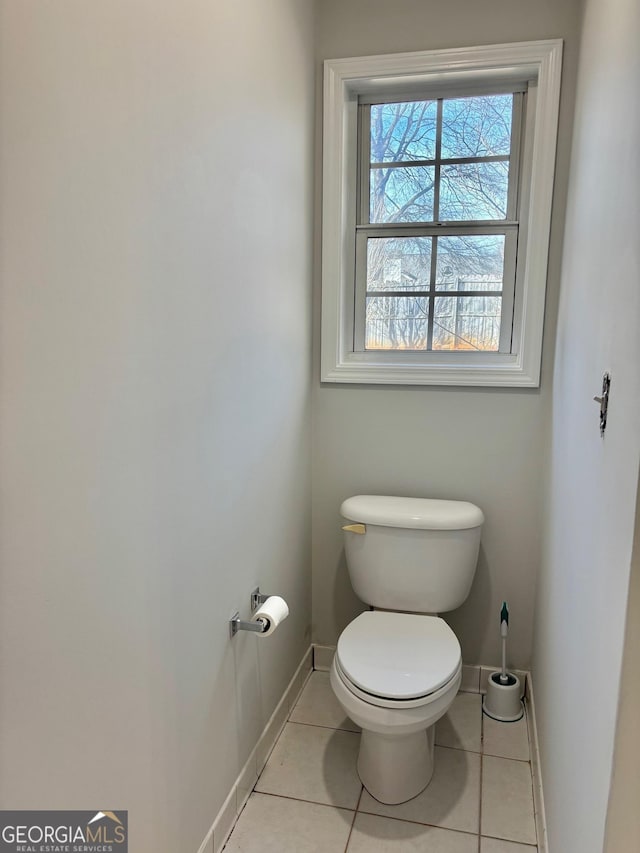 bathroom with tile patterned floors and toilet