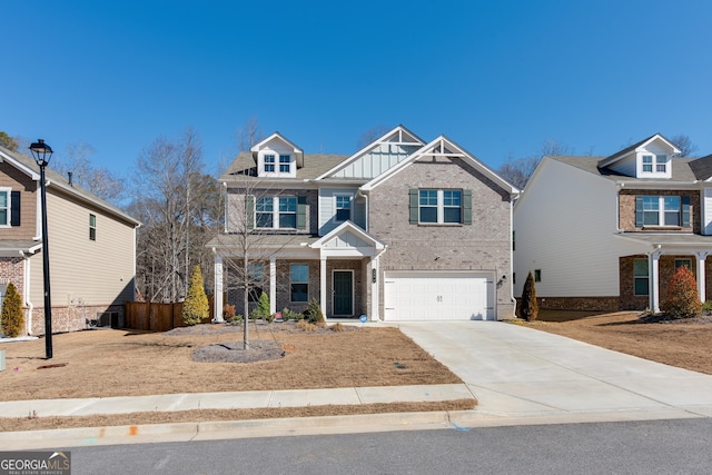 view of front of home with a garage and central AC unit