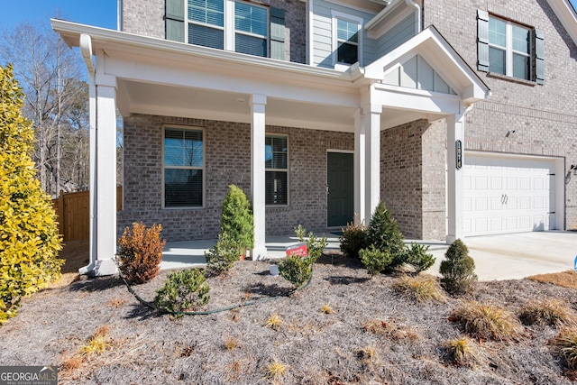 view of front facade featuring a porch and a garage