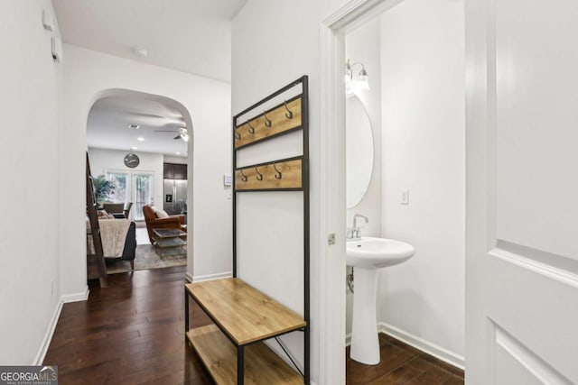 bathroom with hardwood / wood-style flooring and ceiling fan