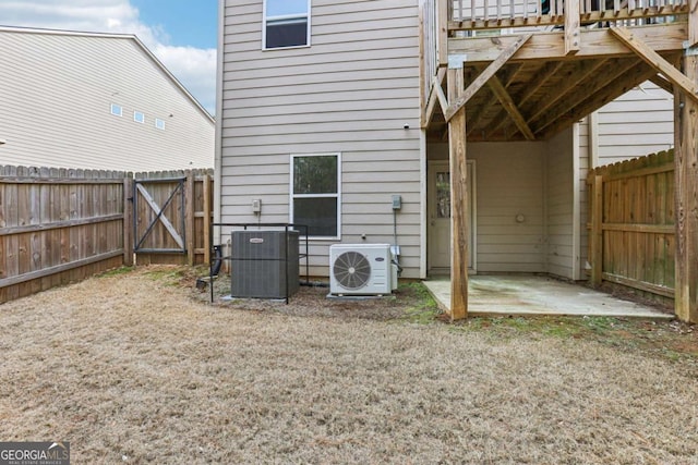 back of house featuring central AC, a patio, and ac unit