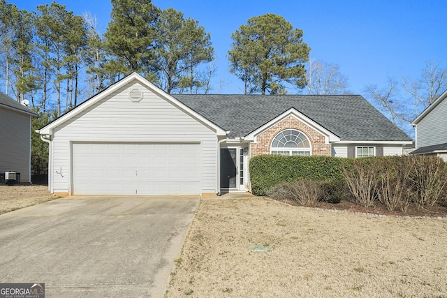 single story home with a garage and central AC