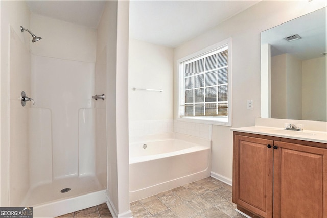 bathroom with vanity and plus walk in shower