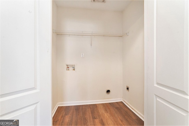 clothes washing area with hookup for a washing machine, dark wood-type flooring, and hookup for an electric dryer