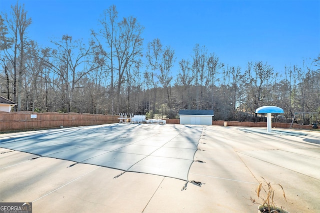 view of pool with a storage unit