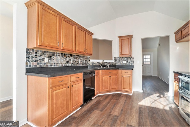 kitchen featuring vaulted ceiling, tasteful backsplash, black dishwasher, sink, and dark hardwood / wood-style flooring