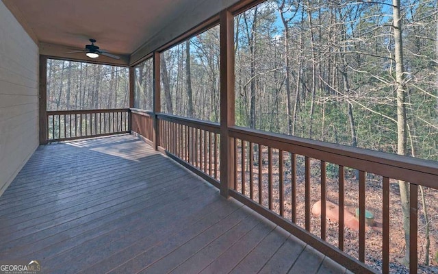 wooden deck featuring ceiling fan